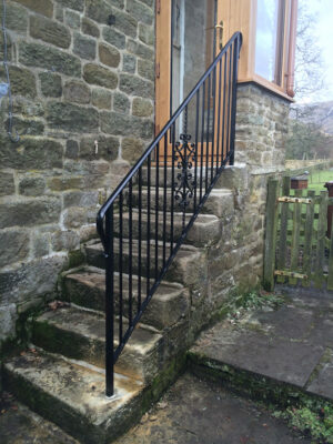 A classy strong black metal railing (by Derbyshire Dales Engineering)