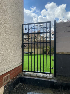 A rectangular, tall black metal gate (by Derbyshire Dales Engineering)