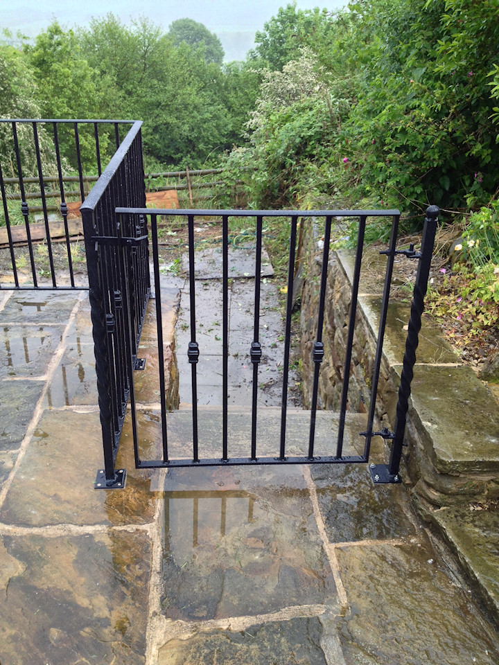 Classic black gate from patio area (by Derbyshire Dales Engineering)