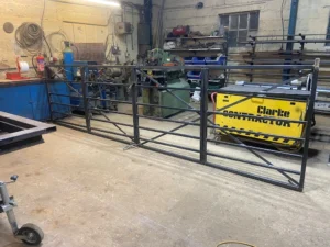 A substantial metal custom gate in the workshop