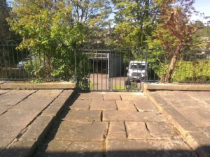 A custom-made metal pair of gates for a domestic environment