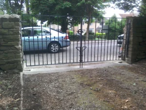 A custom-made metal pair of gates for a domestic driveway