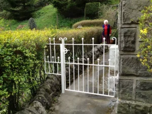 A bespoke domestic metal gate, painted white