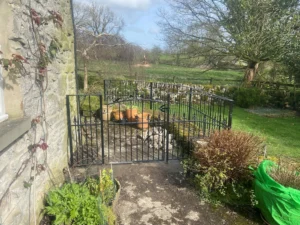 Bespoke black railings and gate to the side of a Derbyshire property