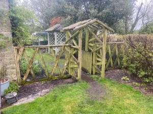 Rotten wooden fence and struction replaced with metal railings and gate (before)