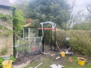 Rotten wooden fence and struction replaced with metal railings and gate (close to completion)