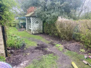 Rotten wooden fence and struction replaced with metal railings and gate (pre-installation)